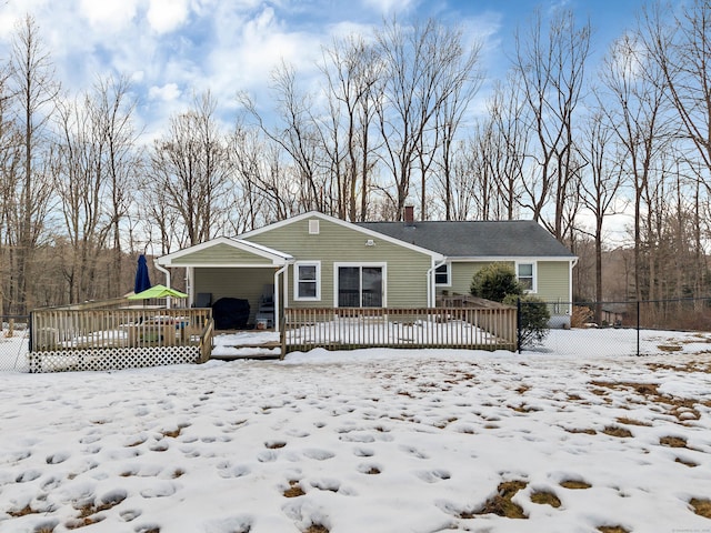 view of front of property featuring a chimney and a deck