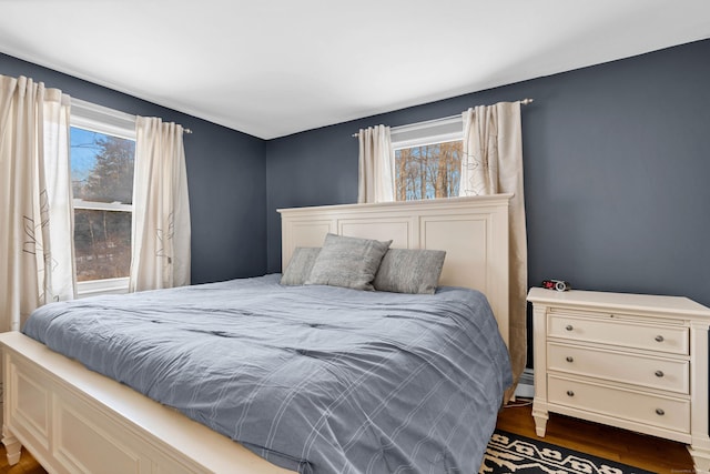 bedroom featuring dark wood-type flooring