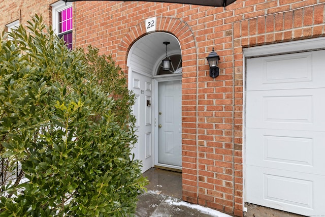 property entrance with brick siding