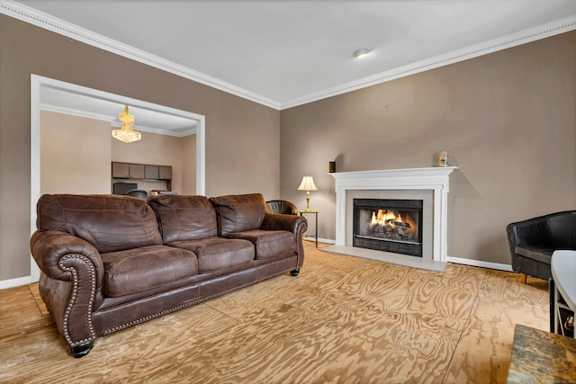 living area featuring a fireplace with flush hearth, baseboards, and crown molding