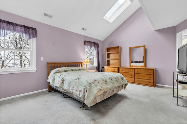 bedroom featuring carpet floors, a skylight, baseboards, and visible vents