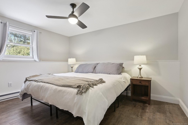 bedroom with dark wood-style floors, a ceiling fan, and baseboards