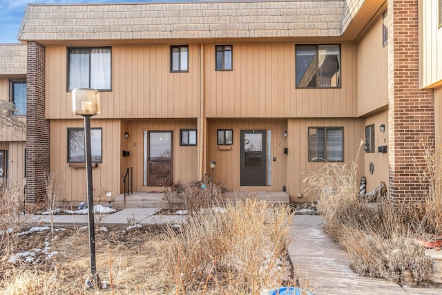 multi unit property with brick siding and mansard roof