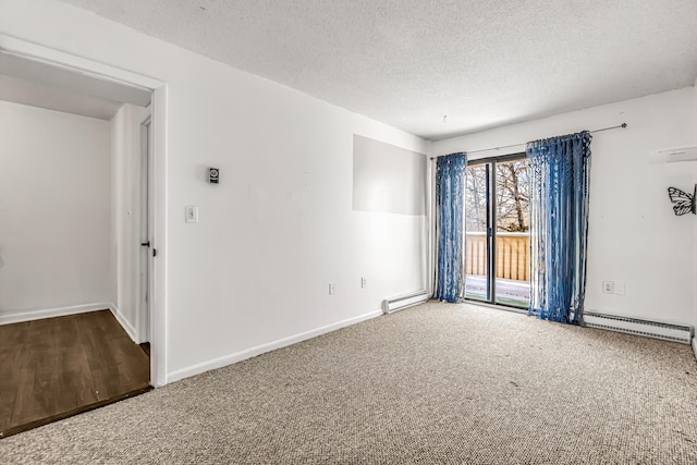 carpeted spare room featuring a baseboard radiator, baseboards, and a textured ceiling