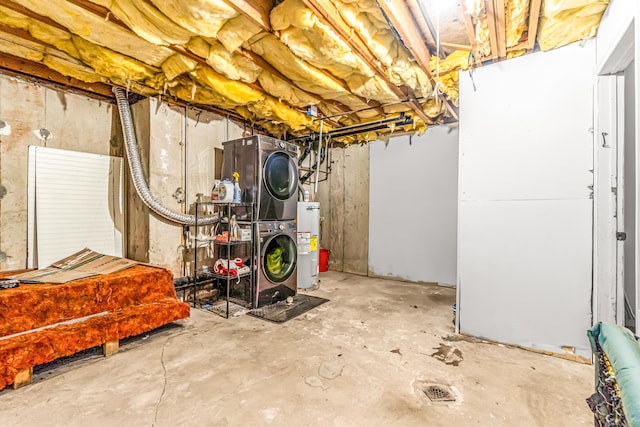 unfinished basement with water heater and stacked washer and clothes dryer