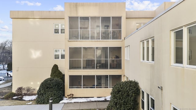 view of side of home featuring stucco siding