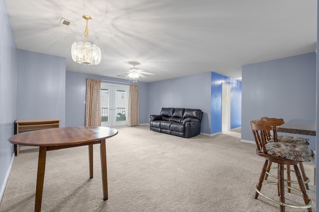 living room with baseboards, carpet flooring, and french doors