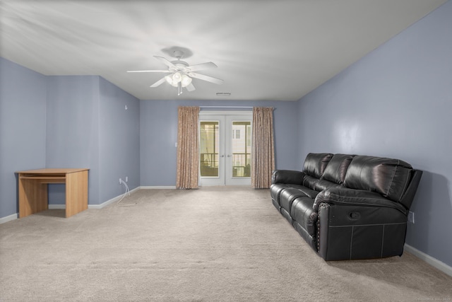 living area with baseboards, french doors, and light colored carpet