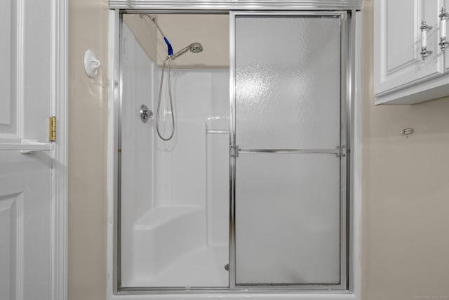 full bathroom with a stall shower