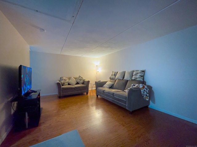 living room with wood finished floors and baseboards