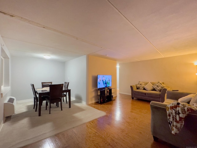 living room featuring baseboards and light wood finished floors