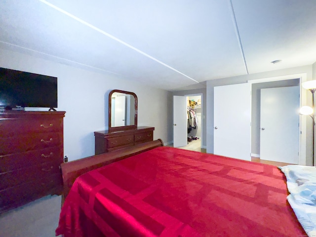 bedroom with a walk in closet