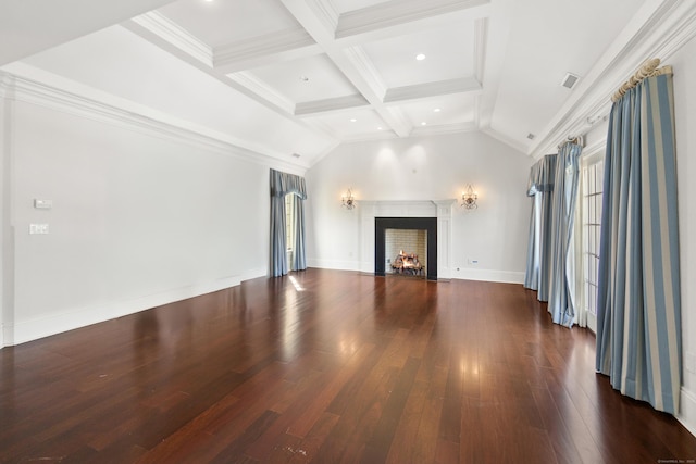 unfurnished living room with visible vents, wood finished floors, vaulted ceiling with beams, a lit fireplace, and crown molding