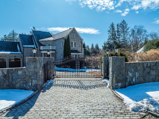 view of snow covered gate