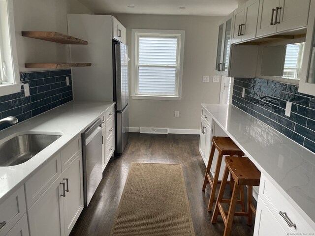 324 Maple St, Branford, CT 06405 - kitchen featuring decorative backsplash, open shelves, stainless steel appliances, and dark wood-style floors