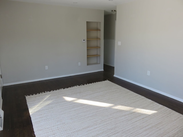 324 Maple St, Branford, CT 06405 - unfurnished room with baseboards and dark wood-type flooring