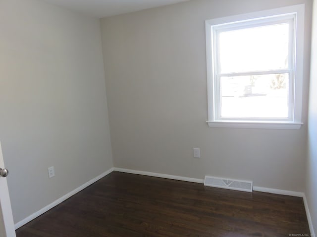 324 Maple St, Branford, CT 06405 - unfurnished room featuring dark wood finished floors, baseboards, and visible vents