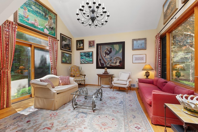 living room with visible vents, baseboards, a chandelier, vaulted ceiling, and wood finished floors