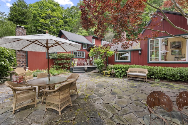 view of patio featuring outdoor dining area