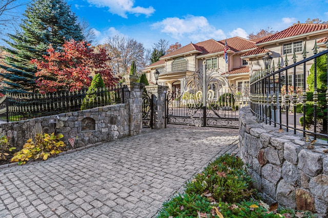 view of gate featuring a fenced front yard