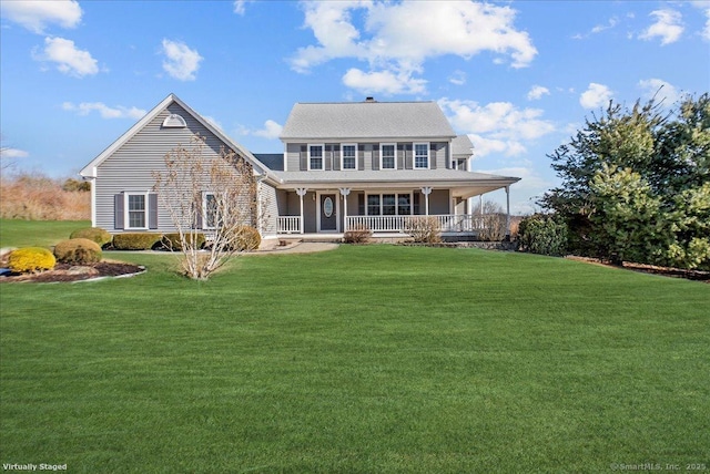 view of front facade with covered porch and a front yard