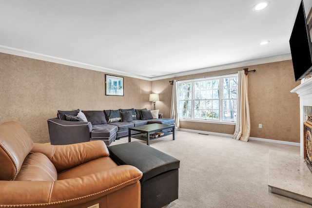 living area with baseboards, a high end fireplace, light colored carpet, crown molding, and recessed lighting