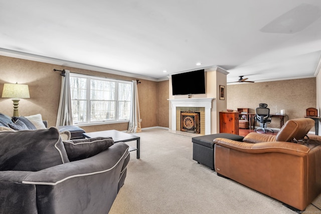 living area with ceiling fan, recessed lighting, light carpet, a fireplace, and ornamental molding