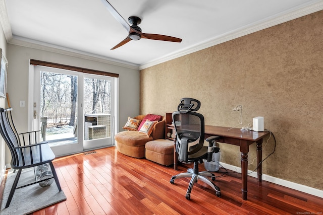 office area featuring baseboards, visible vents, ornamental molding, and wood finished floors