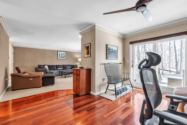 workout area with a ceiling fan, baseboards, ornamental molding, and wood finished floors