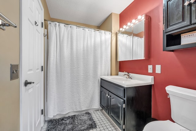 bathroom with curtained shower, vanity, toilet, and tile patterned floors