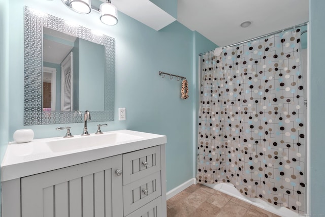 bathroom featuring tile patterned flooring and vanity