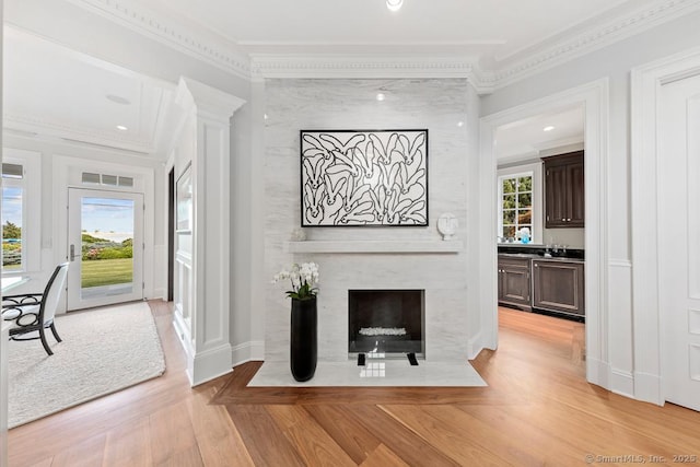 260 Hillspoint Rd, Westport, CT 06880 - interior space featuring light wood-type flooring, a healthy amount of sunlight, crown molding, and visible vents