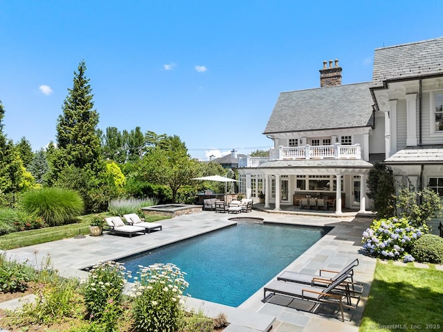 260 Hillspoint Rd, Westport, CT 06880 - pool with exterior bar, a hot tub, an outdoor hangout area, and a patio