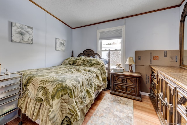 bedroom featuring light wood-type flooring, a textured ceiling, vaulted ceiling, and crown molding