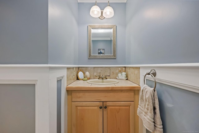 bathroom featuring tasteful backsplash and vanity