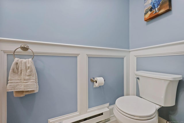 bathroom featuring a baseboard radiator and toilet