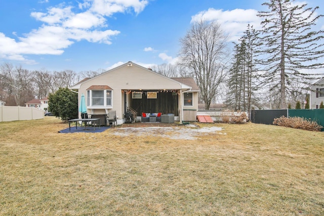 rear view of house with cooling unit, a lawn, and fence