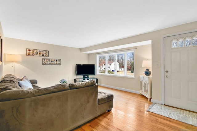 living room featuring light wood-style floors and baseboards