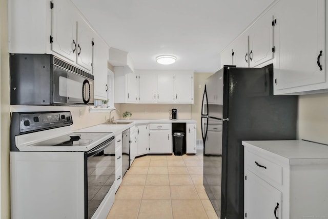 kitchen featuring black appliances, a sink, white cabinets, light tile patterned flooring, and light countertops