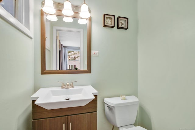 half bath with toilet and vanity