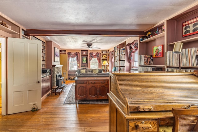 kitchen featuring a fireplace, ceiling fan, dark wood finished floors, and open shelves