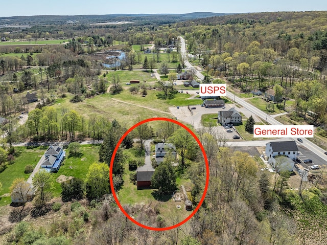 aerial view featuring a wooded view