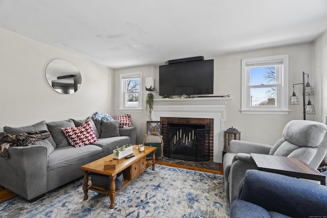 living area featuring a fireplace and wood finished floors