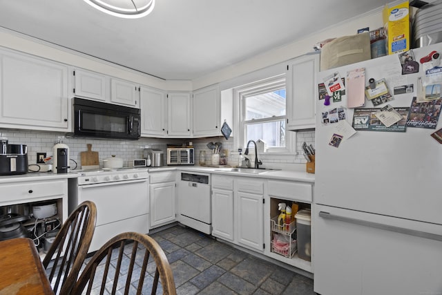 kitchen featuring light countertops, white appliances, a sink, and white cabinetry