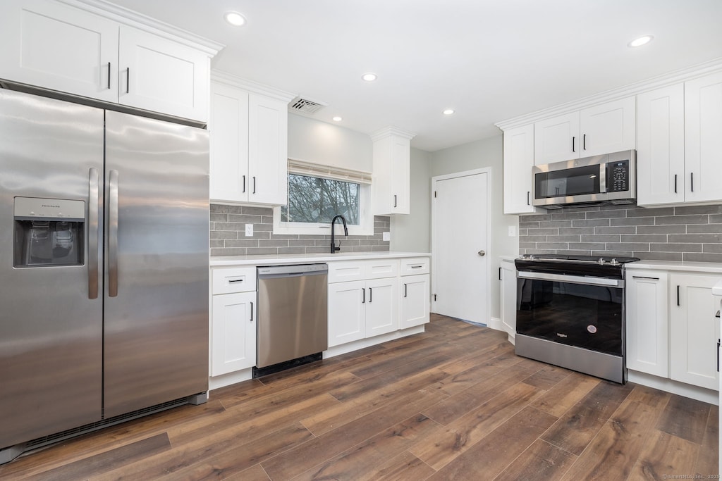 kitchen featuring appliances with stainless steel finishes and white cabinets