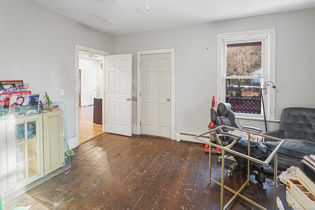 sitting room featuring dark wood-type flooring