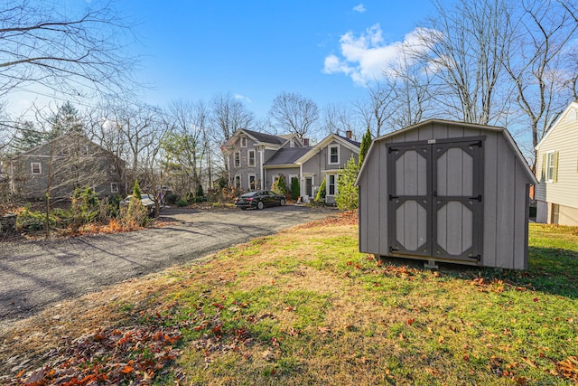 exterior space with driveway and a residential view