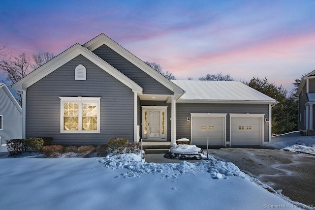 ranch-style house with driveway and an attached garage