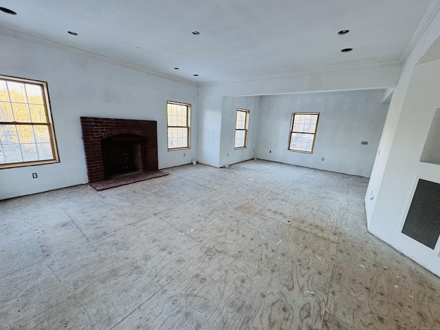 unfurnished living room with a fireplace and ornamental molding