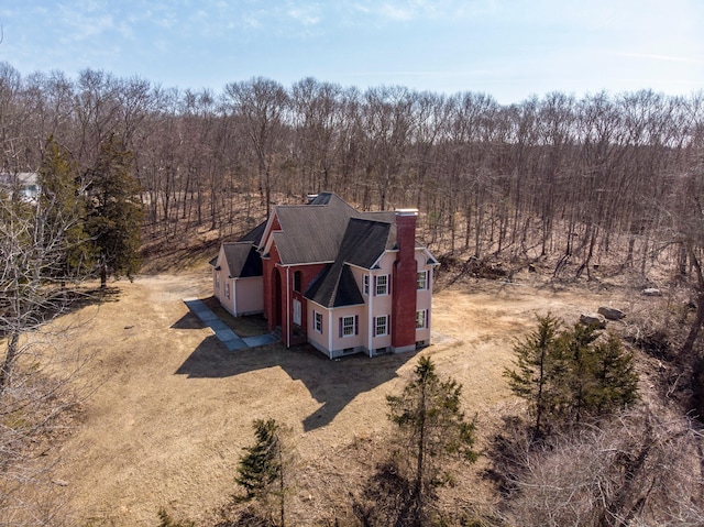 drone / aerial view with a view of trees